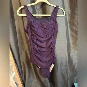 Unknown source  One Piece Swimsuit with mesh top and tummy control